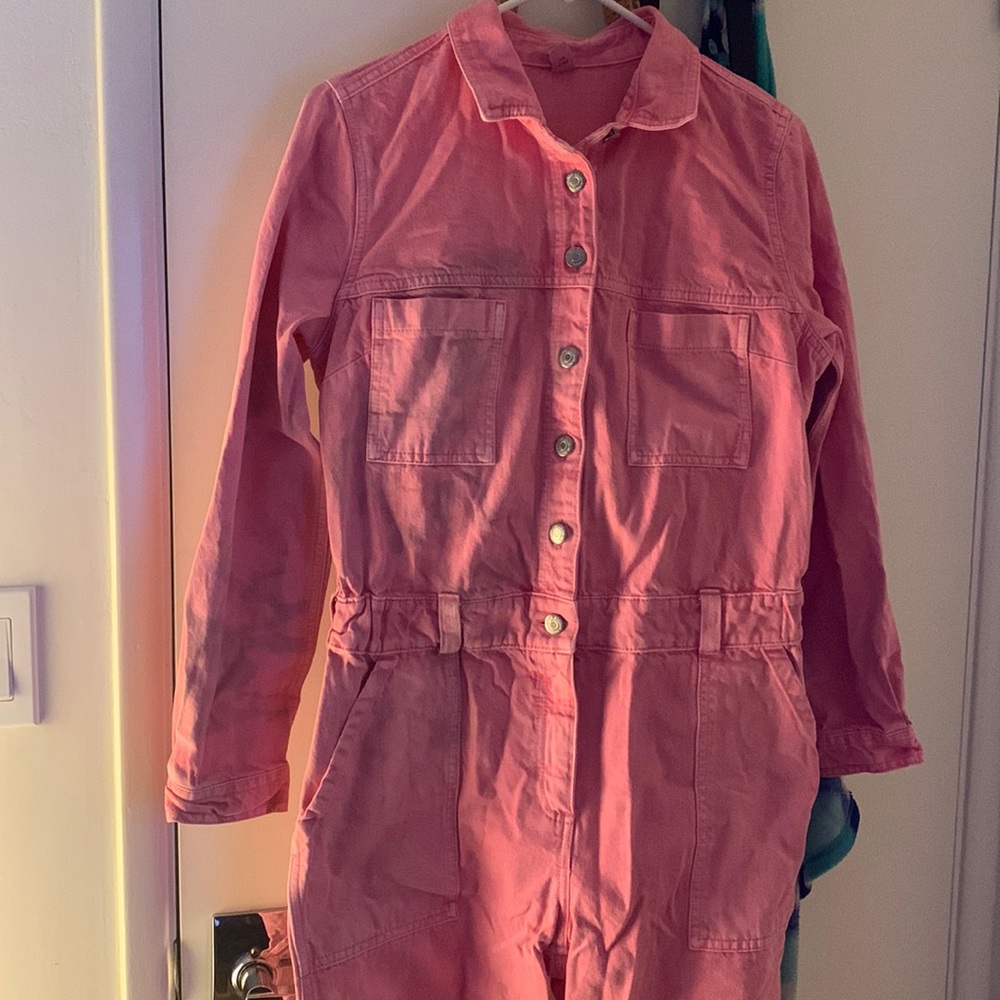 Pink denim jumpsuit with wine stain